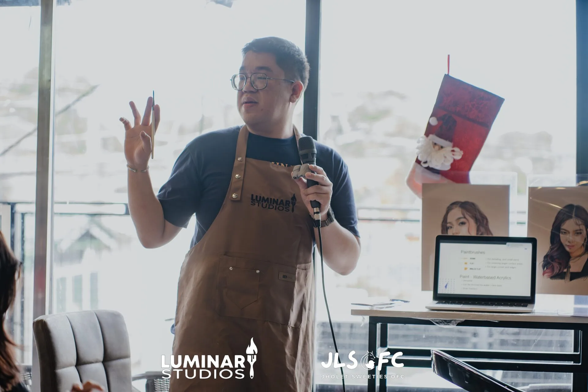 Close-up of brush painting a figure